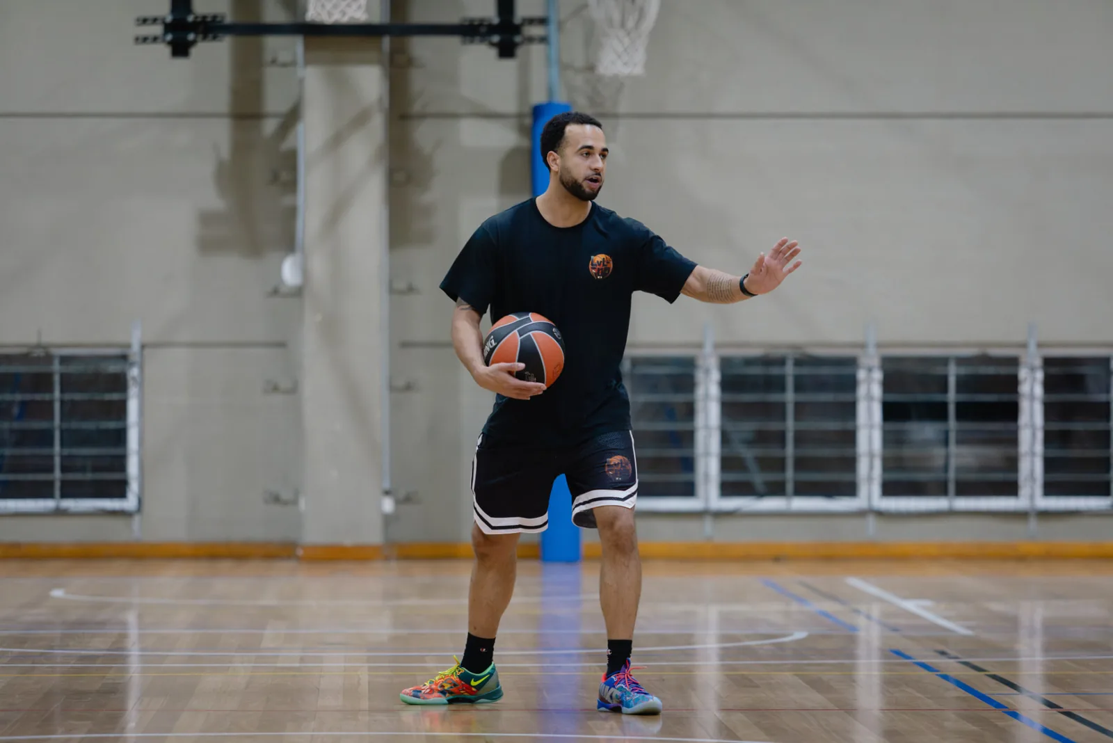 Coach demonstrating a move on court